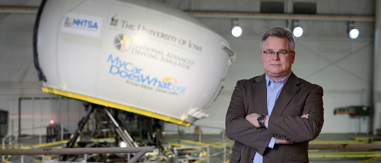 Director Dan McGehee in front of the NADS-1 simulator